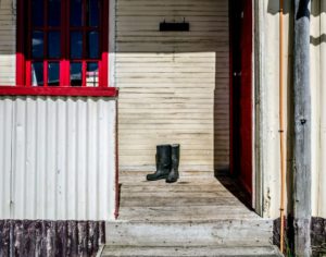 This is the entrance of the home of one of the stable hands - the boots ready for the next day's work.