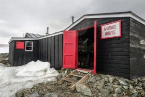 The Falkland Islands Dependencies Survey established a base on Antarctica's Winter Island in 1947. The main hut was named "Wordie House" after Sir James Wordie, a member of Shackleton's Imperial Trans-Antarctic Expedition who visited during its construction.