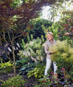 Here is a photo from the book of me in my garden. The book talks about my love for gardening and how I worked alongside my father, helping him to cultivate the soil and grow beautiful healthy flowers in the gardens behind my childhood home. (Photo from “Martha’s Flowers”)