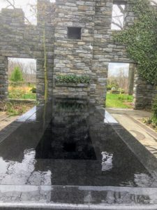 The Ruin Garden was built on the foundation of the Minder House, where Adolph Rosengarten, Jr. lived most of his life. For safety reasons, the only original parts of the house, were the foundation and the tile 'rug'. Here is the 24-foot long Reflecting Pool at the base of the Ruin Garden mantle - all beneath a towering fireplace chimney.