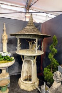 This garden piece drew lots of looks with its faux bois branch posts and large stone roof. This would look great at the center of a parterre.