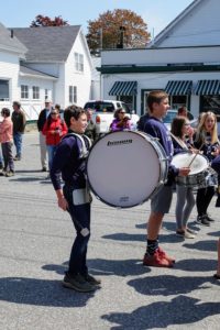 And following the woodwind instruments were the drums. Here is a band member with his heavy marching bass drum.