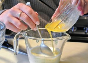The recipe also calls for butter, which is melted and stirred into cold milk.