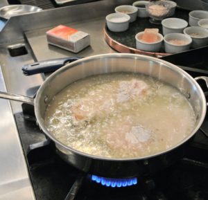 The chicken is then cooked in a half-inch of oil in a medium pan or skillet and cooked over medium heat.