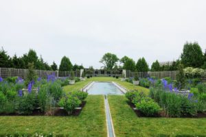 The long pool includes a runnel to a lily pond. The pool is lined with blue tiles arranged in a Persian-inspired fashion. The restored water system allows water to be recirculated through the pool, lily pond and the basin that feeds the runnel without the use of chemicals.