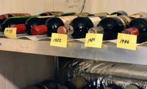 Temporary sticky notes are used to identify the vintage year of each section. The characteristics of a vintage year are determined by weather and the quality of that year's grape crop. Vintages are most important when collecting wines designed to be aged.