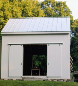 All the supper events at Dirt Road Farm are served in this barn. This newly restored barn was built on the exact footprint of the original antique structure. The barn, built by the late Matthew Franjola, has both wooden barn doors and glass French doors that secure both the back and front of the space.