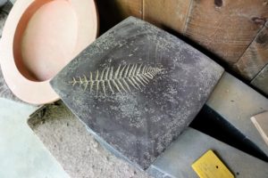 Lunaform also makes tables. One client wanted a fern leaf embedded into the concrete top of a table. This was the sample - it was exactly what the client envisioned.