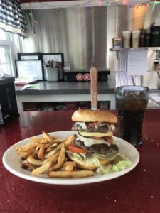 Here was Kevin's lunch - a DinahMoe Burger with two ground beef burgers, lettuce, tomato, bacon, and cheese on a roll with fries.