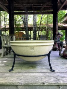 This is called Morgan's cauldron, made of concrete and iron. It is perfectly round on the bottom and is 37.5 inches in diameter. A hand-forged iron stand will hold the urn perfectly upright.