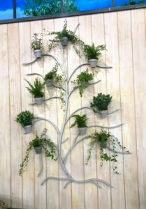 And here is my 71-inch Metal Wall Tree in gray. These decorative trees can be used indoors and out. It comes with 11-pots for all your little plantings.