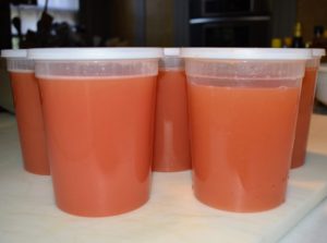 And then pours the juice into quart-sized plastic containers - no seeds – just pure, delicious tomato juice! I can't wait to enjoy a glass of refreshing, organic juice - straight from my garden.