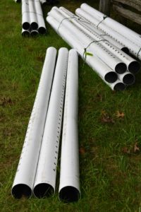 This is perforated drain pipe. The area needed 475-feet of this pipe to completely surround the space. The perforated pipe provides drainage along the full length of the pipe.