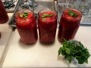 Here are some jars of red tomatoes ready to be covered - I just love the bold color.