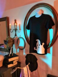 Using empty frames bought at tag sales make great decorations for Halloween. Here we hung our ghost t-shirt, made using the Cricut Explore Air 2 and EasyPress.