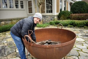 Outside, Fernando places logs in my giant sugar pot, so I can build a fire before guests arrive - we are expecting frigid cold temperatures in the Northeast!