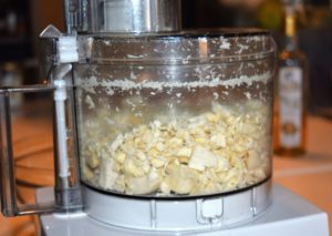 Using a food processor, pulverize the peeled horseradish root until well ground. Add a tablespoon of water if necessary.
