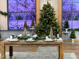 This season, I've got so many beautiful holiday decorations for your home. I love the festive look of this table-scape filled with shimmering gold and beautiful faux evergreens.