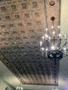 This 16th century coffered ceiling is from a palace in southern Italy, carved in a design of squares and crosses with rosettes in the center.