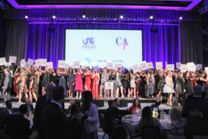 200 students were celebrated along with the finalists and scholarship recipients - here is a group photo of the students on stage. (Photo by Cindy Ord/Getty Images for Fashion Scholarship Fund )