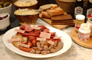When feeding a crowd, also consider a sausage buffet. An assortment of wursts may be prepared and served room temperature, with rolls and breads, mustards, sauerkraut, pickles, and onions.