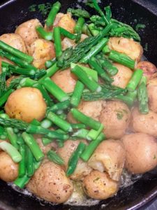 Rodney also cooked new potatoes in butter and then fried them with pieces of asparagus.