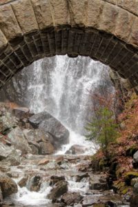 This is called Waterfall Bridge. Waterfall Bridge is one of the classic and majestic Rockefeller bridges, completed in 1925 and spanning roughly 120- feet. Waterfall Bridge is situated along Hadlock Brook just downstream from the 40-foot tall Hadlock Falls which flows through its skewed arch.
