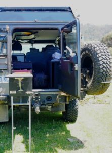Her Land Rover Defender is outfitted with stoves, ice boxes, and lots of room for chairs, dishes and other cooking supplies.