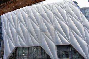 This is called The Shed - a performance hall whose retractable shell is the signature feature of the 200-thousand square-foot design by architect Diller Scofidio + Renfro and Rockwell Group. The pillowy exterior is made out of weatherproof ETFE panels, and slides from left to right.