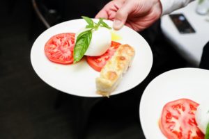Dinner started with a caprese salad with Italian buffalo mozzarella, farm grown basil, Freds olive oil and tomatoes. (Photo by Neil Rasmus, BFA)