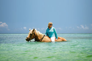 As you know, I love to horseback ride. Here I am riding in the Cayman Islands, one of our new MSC Cruises destinations, where you can take this refreshing ride through the azure colored Caribbean ocean and then enjoy a delicious and organic lunch.