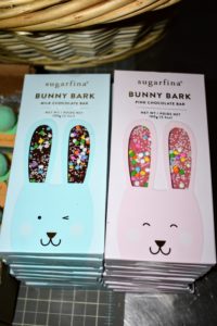 These are limited-edition Bunny Bark chocolate bars from Sugarfina. Each one is made from Parisian chocolate and topped with sparkling sugar and confetti sprinkles. https://www.sugarfina.com
