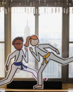 Darcy's sports and fitness-themed illustrated cut-outs were all around - these two martial arts figures sat in front of one of the large windows.