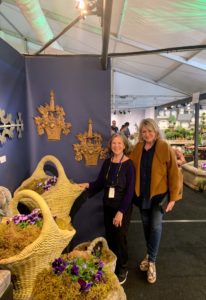 Here I am with Judith Milne - I stop at the Milne booth every year. It always has many large and beautiful outdoor planting containers.