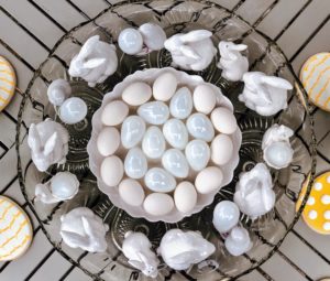 From above, this white collection of glass and porcelain bunnies and eggs looks so charming.