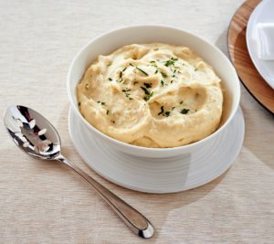 This is my mom's popular mashed potatoes made with potatoes, heavy cream, butter, and cream cheese.