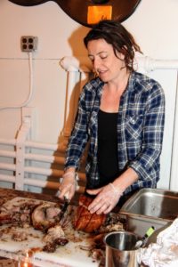 Heather Sandford is co-owner of The Piggery, a farmer-owned butcher shop featuring pork and house-made charcuterie located in Trumansburg, New York. Here she is slicing porchetta. http://www.thepiggery.net/pigblog/ (Photo provided by Unger Media for Mike's Organic)