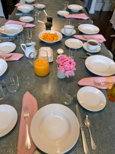 Here is our breakfast table set in spring pink with a single peony bloom at the center. I also served oatmeal, fresh mango, and fresh squeezed orange juice.