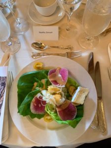 Here is my place setting and the delicious first course spring salad with butter lettuce, watermelon radish, shaved fennel, yellow teardrop tomatoes, brie crostini and a pink grapefruit vinaigrette.