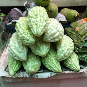 This is called ampalaya bitter melon, Momordica charantia - a tropical and subtropical vine of the family Cucurbitaceae, It is widely grown in the Amazon, Carribean, and the Philippines for its edible fruit. Bitter melon is filled with antioxidants, and helps to reduce blood sugar and cholesterol.