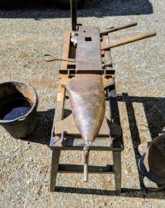 This is the anvil. It has a large, wide face to accommodate a variety of shoes and a rounded, tapered heel. An anvil can weigh anywhere between 150 and 500 pounds.