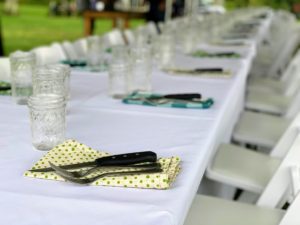 Though under a tent, we kept to the format of a beautiful, long table with linens. Mason jars held our wine and water. I wasn’t sure if Martha would have approved of the utensils all on the napkins like this, but we needed them for weight against the wind!