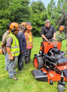 Tom also goes over the stand-on mower. This mower allows the user to comfortably stand behind the machine as it mows. Stand-on mowers are easy to maneuver through tight spaces and can be used on uneven landscapes.