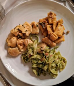 For the entree, three different types of pasta - squash tortellini, boar ragu garganelli, and linguini provencal tomatoes with pine nuts pesto.