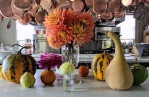 And here is a beautiful arrangement on my kitchen counter together with some of the gourds and winter squash picked from my garden. If lucky, these arrangements should last four to six days - they're so beautiful.