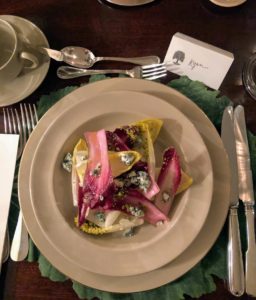 The salad is made with fresh endives, Roquefort, a flavorful sheep milk cheese from the south of France, and crushed Sicilian pistachios.