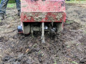 The machine is set to till the soil at about six to eight inches deep. On some tillers, the speed of the rotating tines helps determine the speed of the machine.