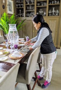 My large Brown Room is a great space for entertaining. The long table is set for 16-guests. Here, Sanu places several small salt and pepper bowls down the length of the table.