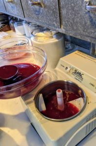The juice from the pomegranates is placed into the sorbet machine. This machine churns the liquid at freezing temperatures making more than a quart of sorbet in about a half-hour.
