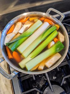 The stock is strained and then these vegetables are cooked in the same meat broth - these are served with the meal. The colors of the fresh vegetables are so vibrant. Cook the vegetables until they are soft.